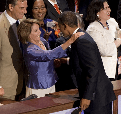 Pelosi congratulates Obama; she is wearing Tahitian pearls