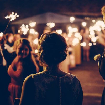 bride and groom enter a wedding reception