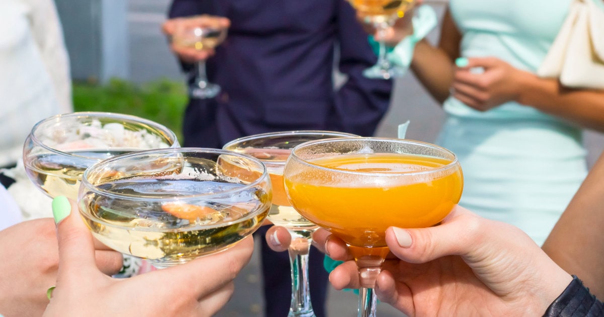people toast cocktails at a semi-formal business event