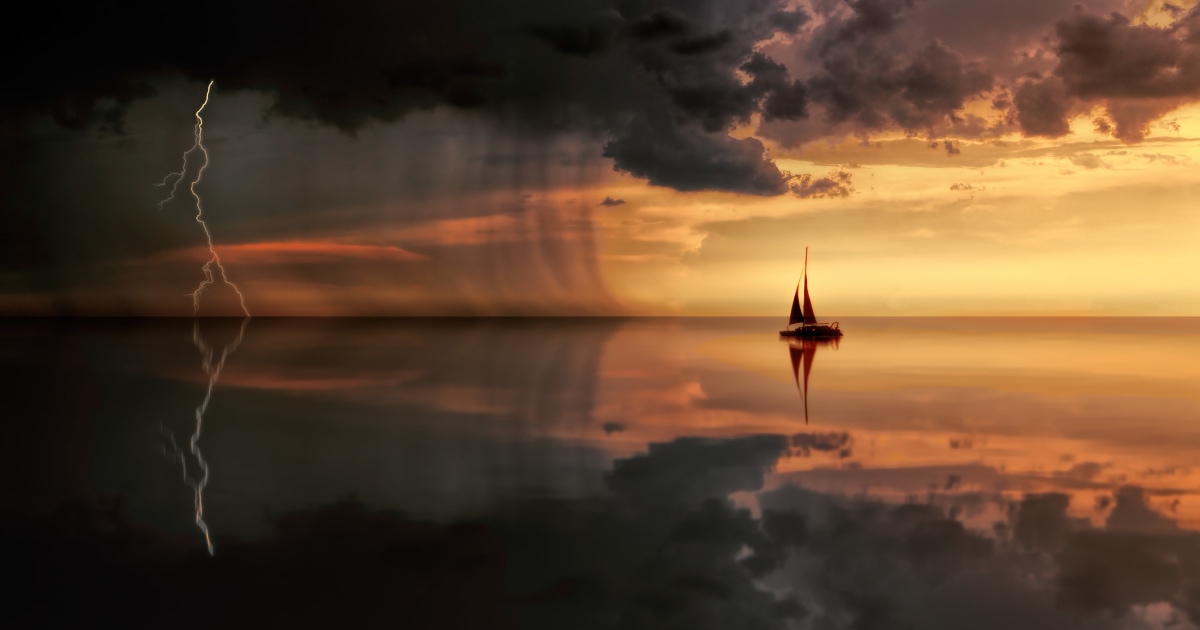 ship heading into a storm at sea