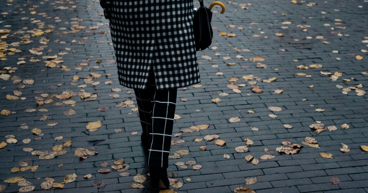 professional woman is mixing two different patterns and prints for her work outfit