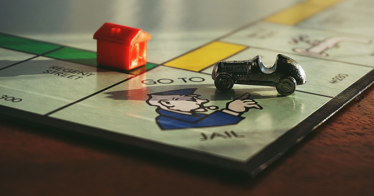 monopoly board with house and car
