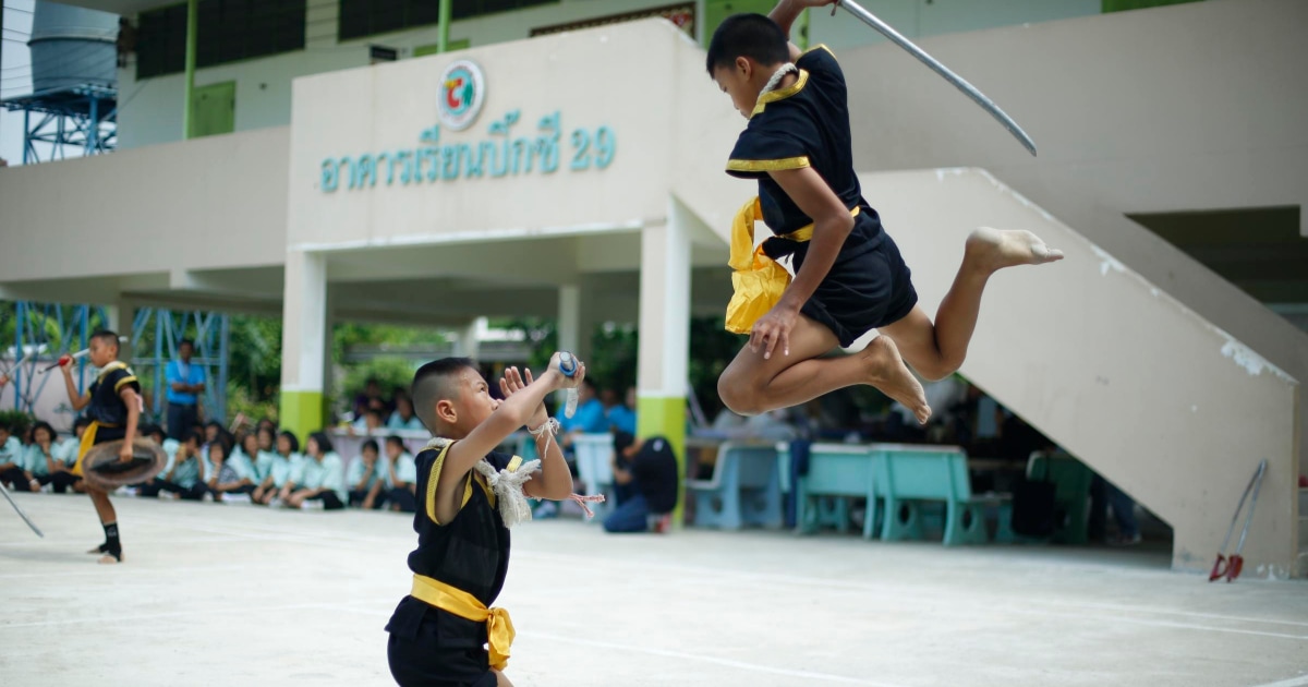 two young boys in a self-defense or martial arts class