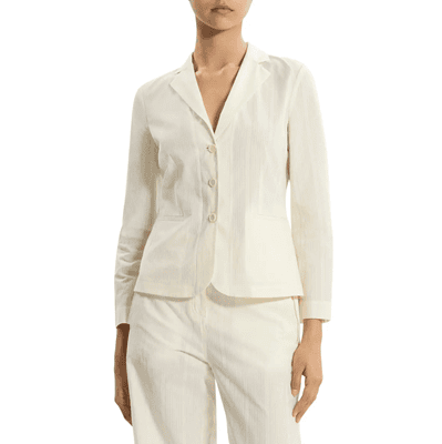woman wears shrunken blazer with bracelet-length sleeves