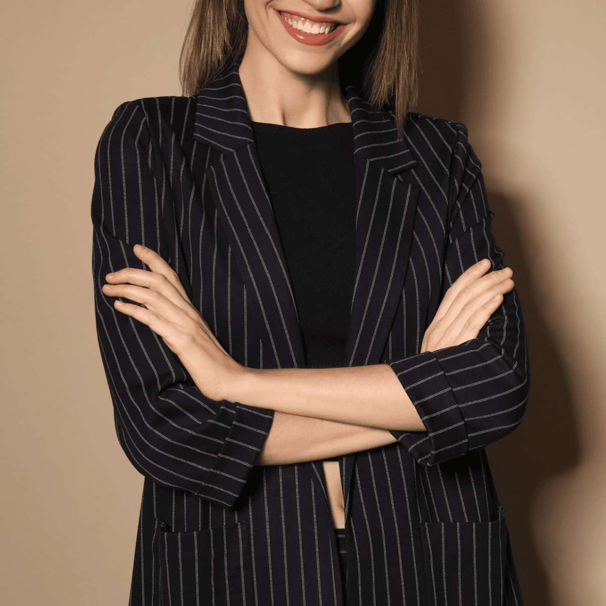 confident young businesswoman wears a pinstriped blazer with three-quarter sleeves