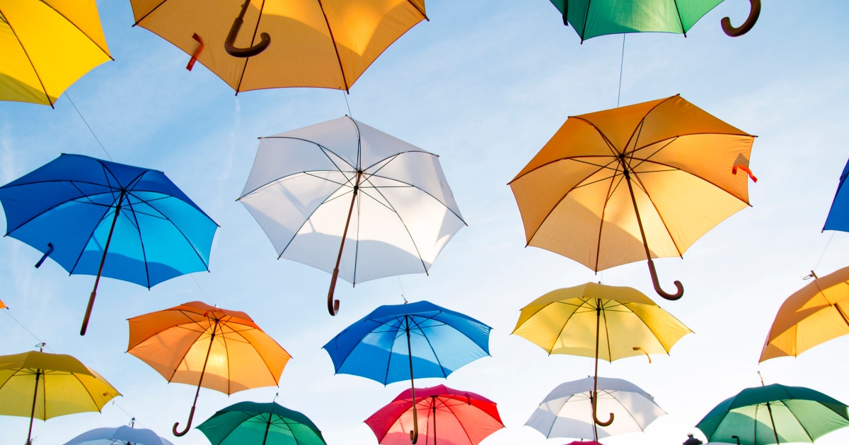 colorful umbrellas floating in the sky