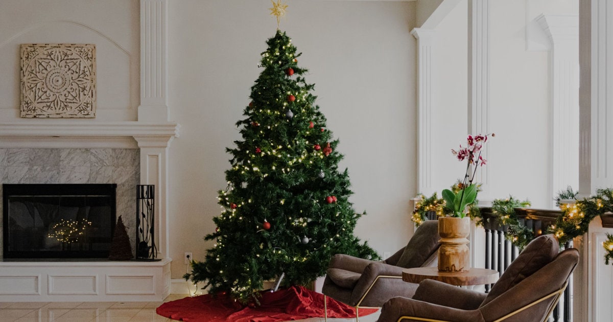 decorated Christmas tree in swanky white living room 