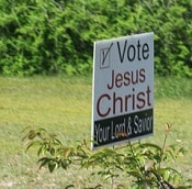lawn sign that says "Vote Jesus Christ Your Lord Savior"