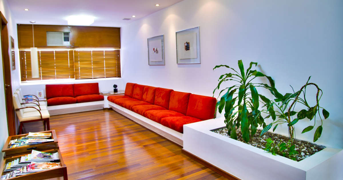 stock photo of doctor office with red waiting chairs