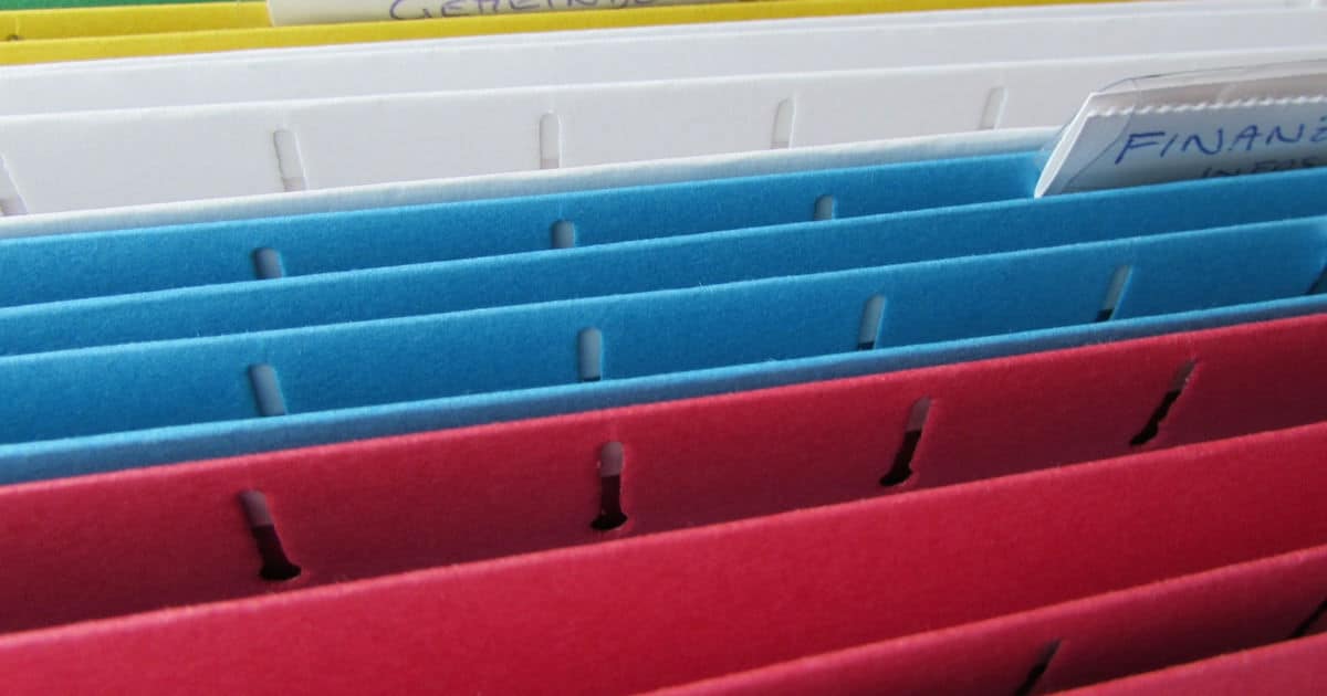 how to organize your office - image of a young woman lawyer's filing system