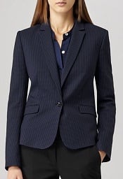 model is wearing black and blue blazer, a navy blouse, and black pants