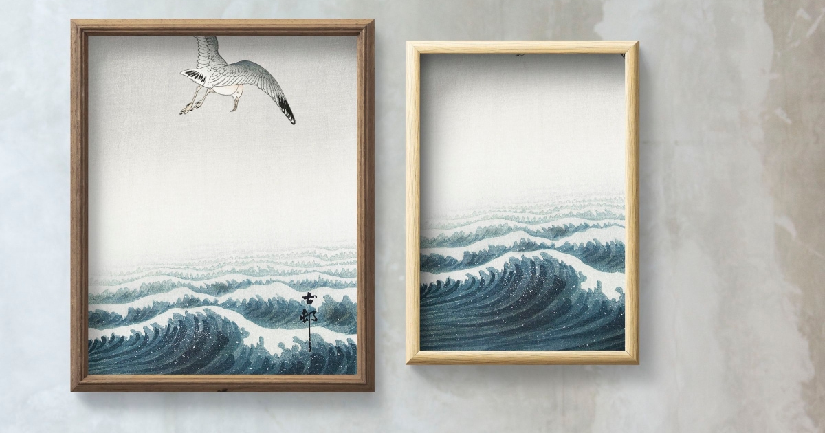 pair of paintings featuring ocean waves and seagull on a gray marbled wall