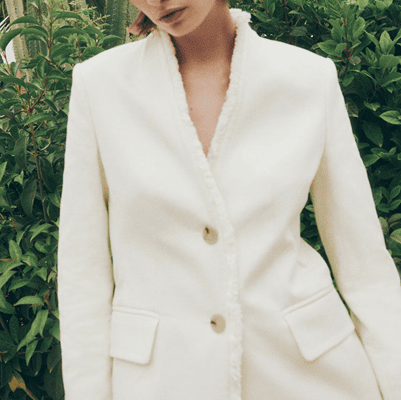 white blazer with frayed edges