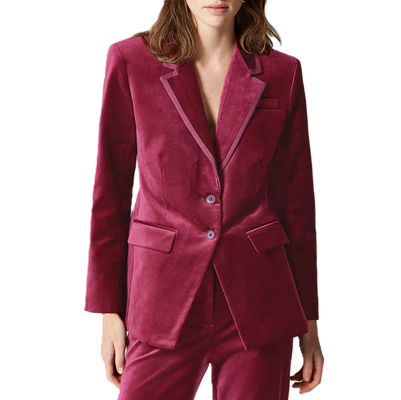 professional woman wears velvet festive blazer