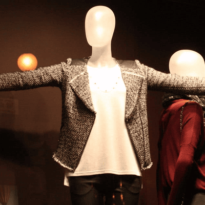 mannequin wears pants, a white top and a blazer as a separate -- it's a great blazer to keep at the office