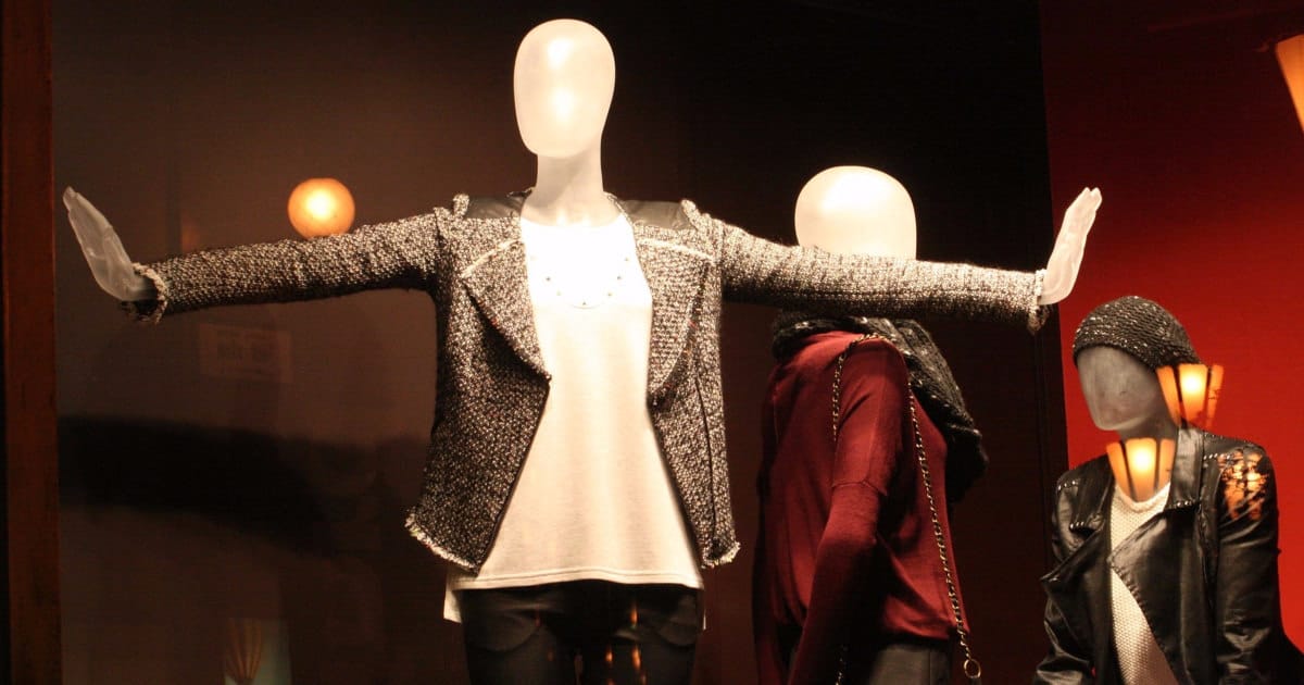 mannequin wears pants, a white top and a blazer as a separate -- it's a great blazer to keep at the office