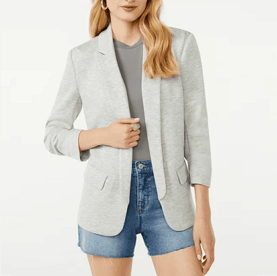 woman wears gray blazer with gray top (shades of shades) with, unfortunately, denim shorts