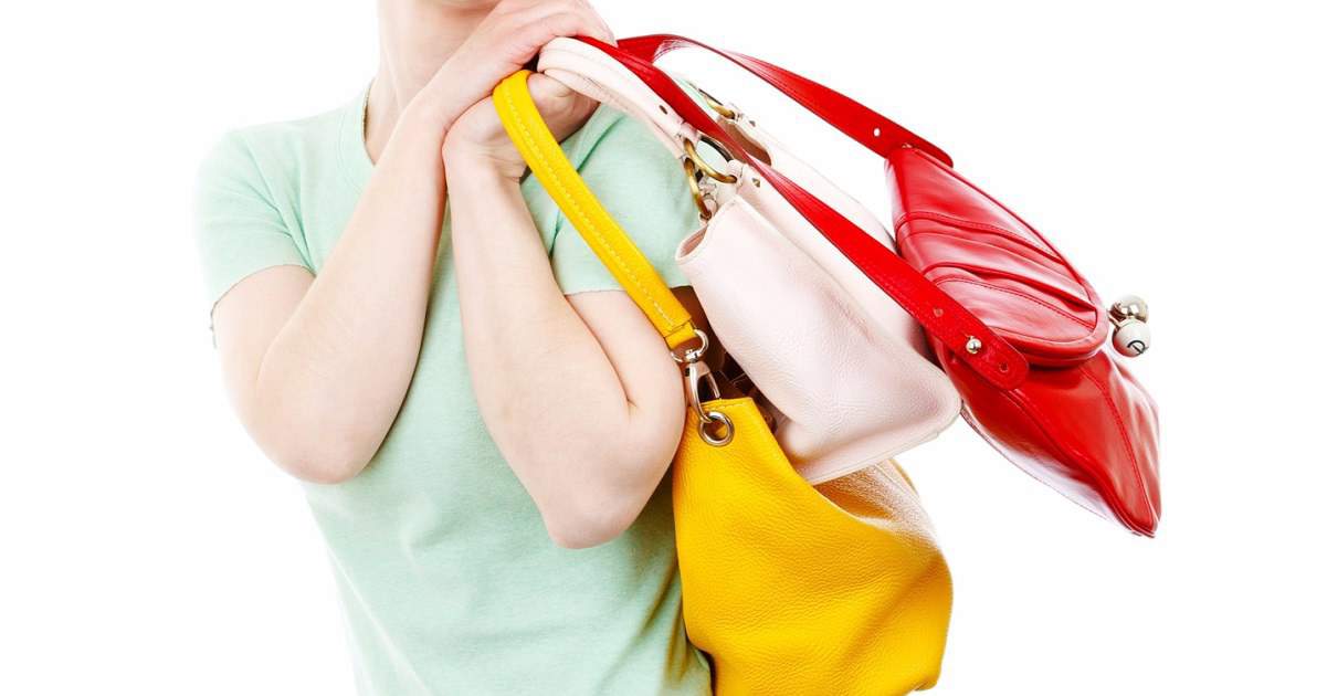 https://corporette.com/wp-content/uploads/2017/05/how-many-bags-should-you-bring-to-work-FB.jpg