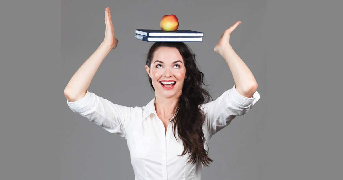Improve Your Posture and Look More Polished - Tips and Tricks. Image of a businesswoman balancing a book on her head.