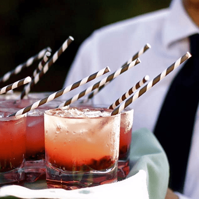 server carries cocktails at business cocktail party