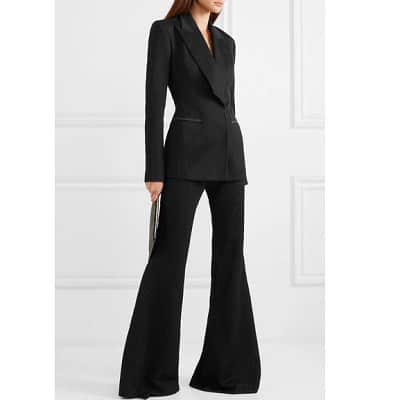 woman wears pantsuit with very wide leg flares