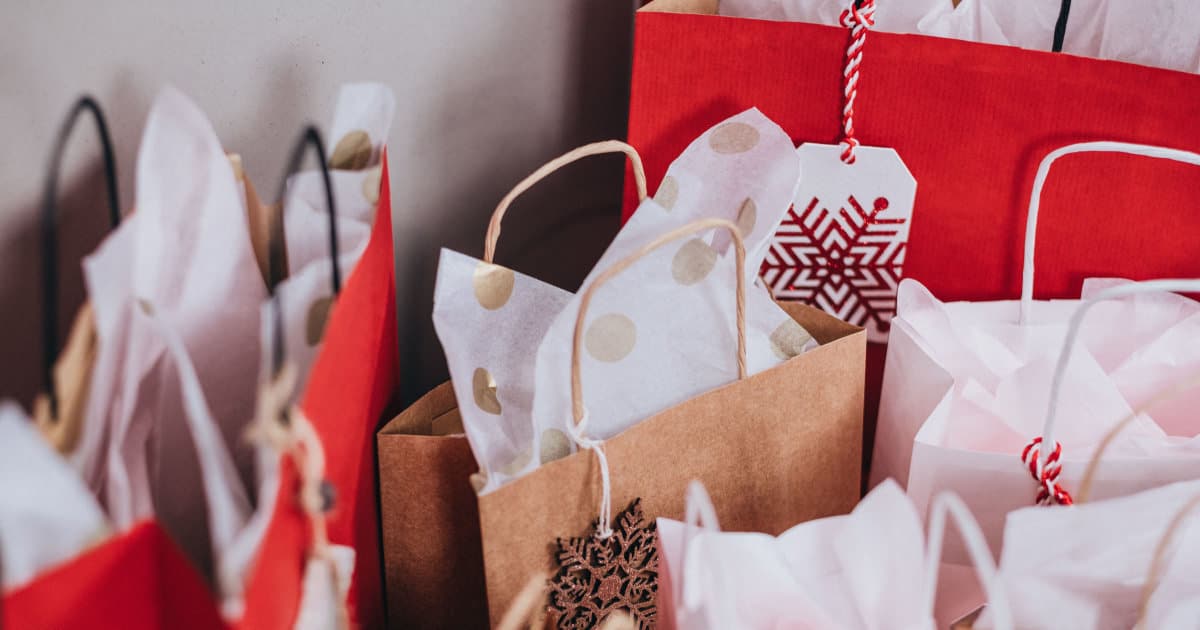 red, brown and white gift bags with wrapping