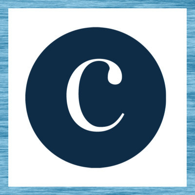 white C in navy circle, surrounded by a space-dye blue paint