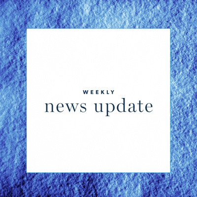 A white square with the text "weekly news update" with a blue border