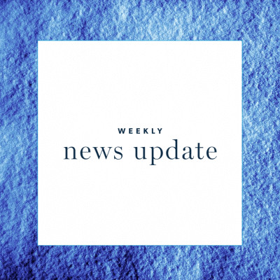 A white square with text "weekly news update" with a blue square border