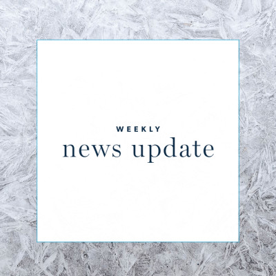 A white square with the text "weekly news update" with a square border of frost around it