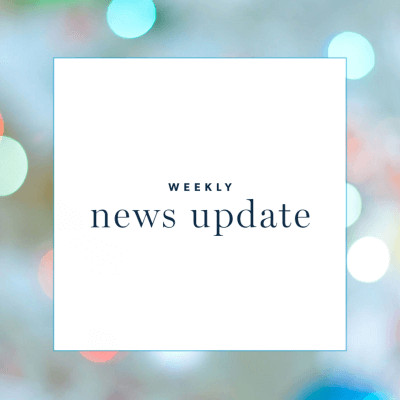 A white square with text "weekly news update," surrounded by a border with points of light