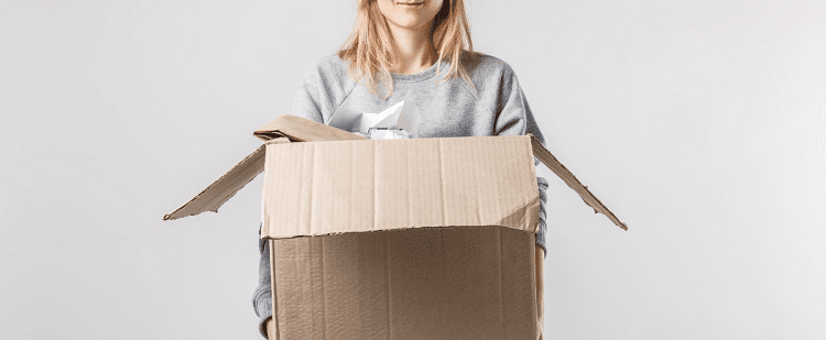 woman holding a large cardboard box
