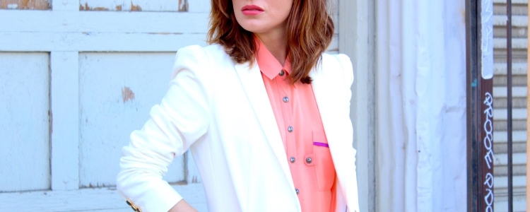woman wears a stylish white blazer with her summer work outfit