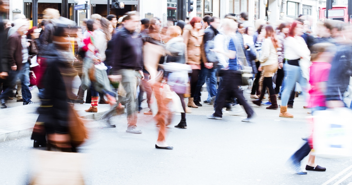 people walking on a busy city street