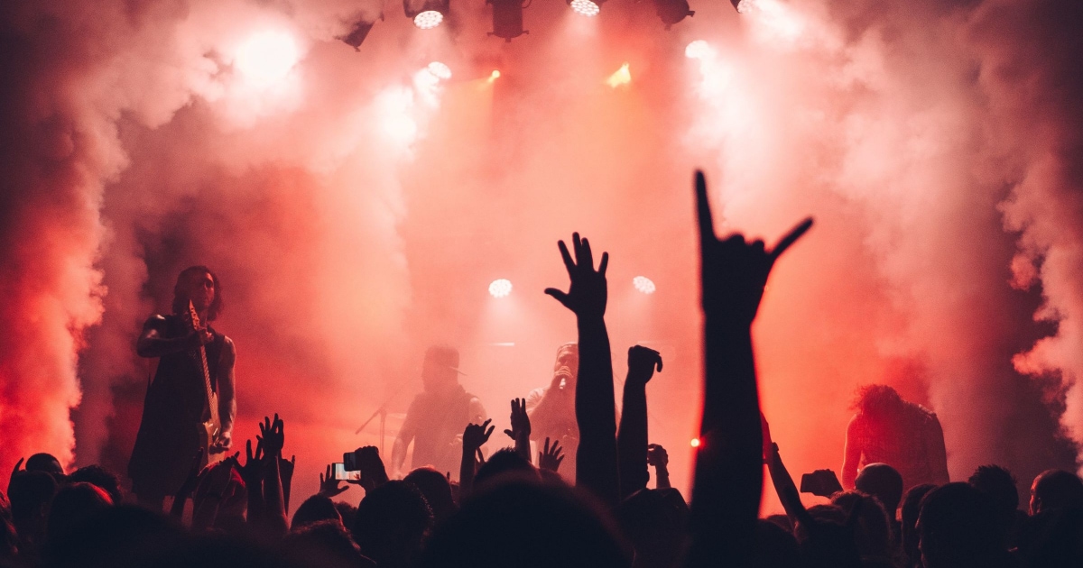 concert shot from the audience with lights and smoke effects