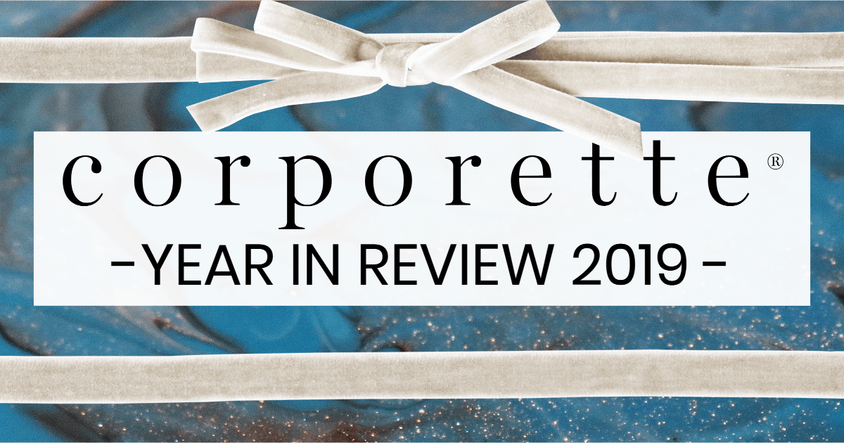 text overlaid on top of glittery paint wrapping paper with white velvet bow, text says "Corporette Year in Review 2019"