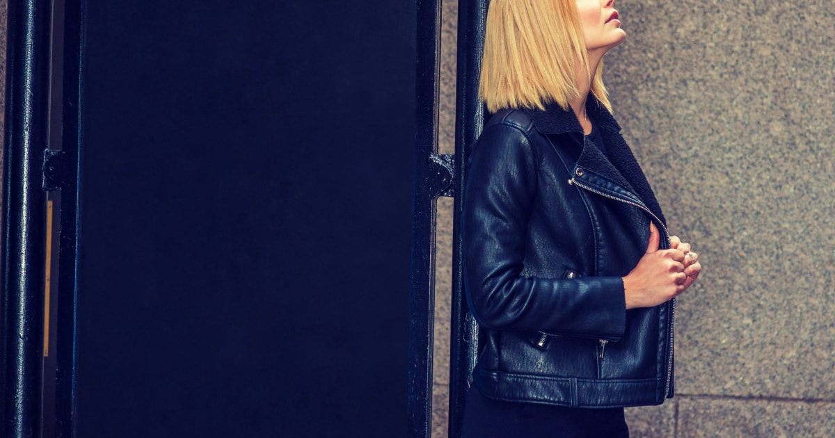 young professional woman wearing a black leather jacket