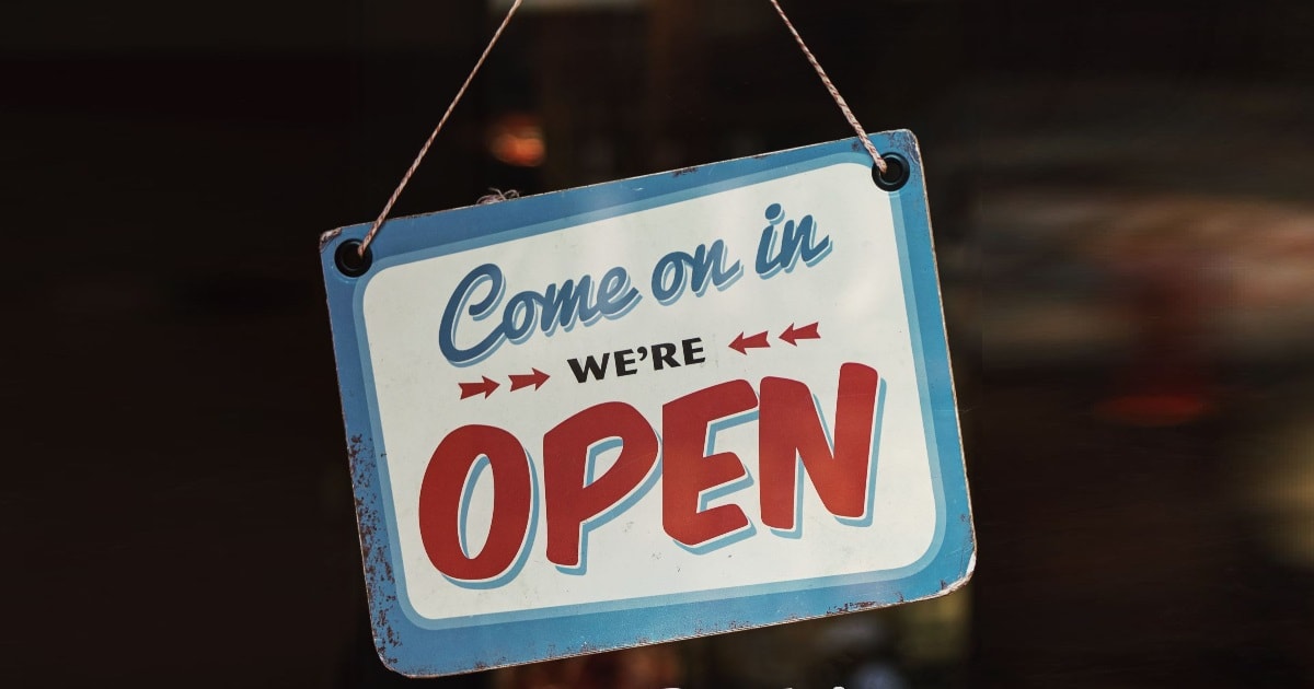 small business sign saying "come on in we're open"