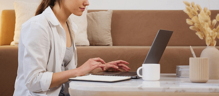 professional young woman typing on laptop