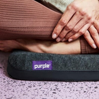 https://corporette.com/wp-content/uploads/2020/07/Purple-cushion.jpg