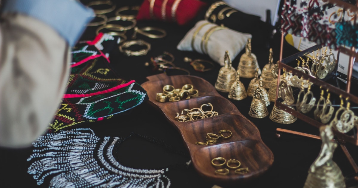 jewelry stored on top of messy dresser