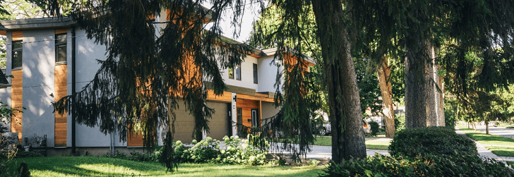 view of suburban house through the trees