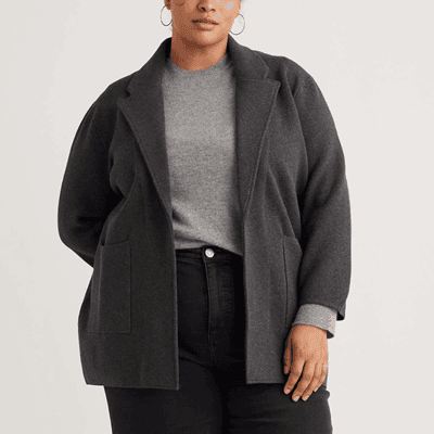 woman wears plus size sweater knit blazer