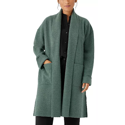 woman wears teal professional winter coat for women