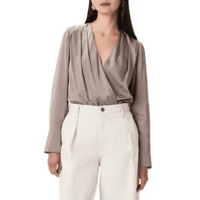 beige silk bodysuit that looks like a blouse tucked into white pants