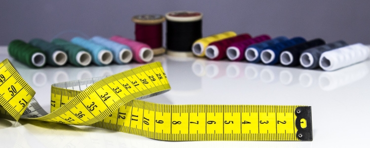 measuring tape and spools of thread