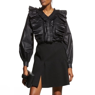 https://corporette.com/wp-content/uploads/2021/08/Bora-Harmonica-Pleated-Blouse-1.jpg