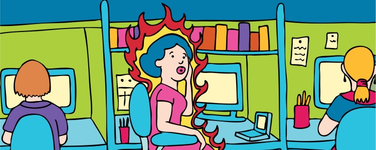 woman in cubicle experiencing a hot flash