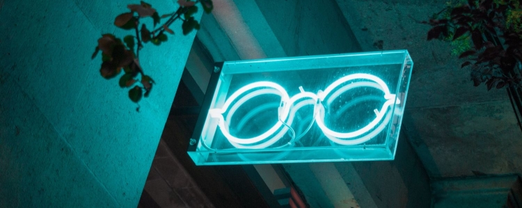 neon eyelgasses sign, lit up at night