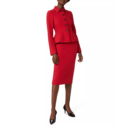 Black model wearing a scarlet red skirt suit with a straight skirt below the knee and a fitted peplum blazer with 5 buttons and a collar